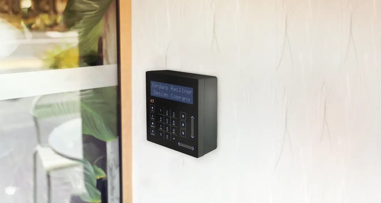 Touch sense keypad with a black back box on a concrete wall