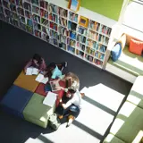 image of children reading books in a library