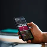 A person controlling their visitor management system from their phone